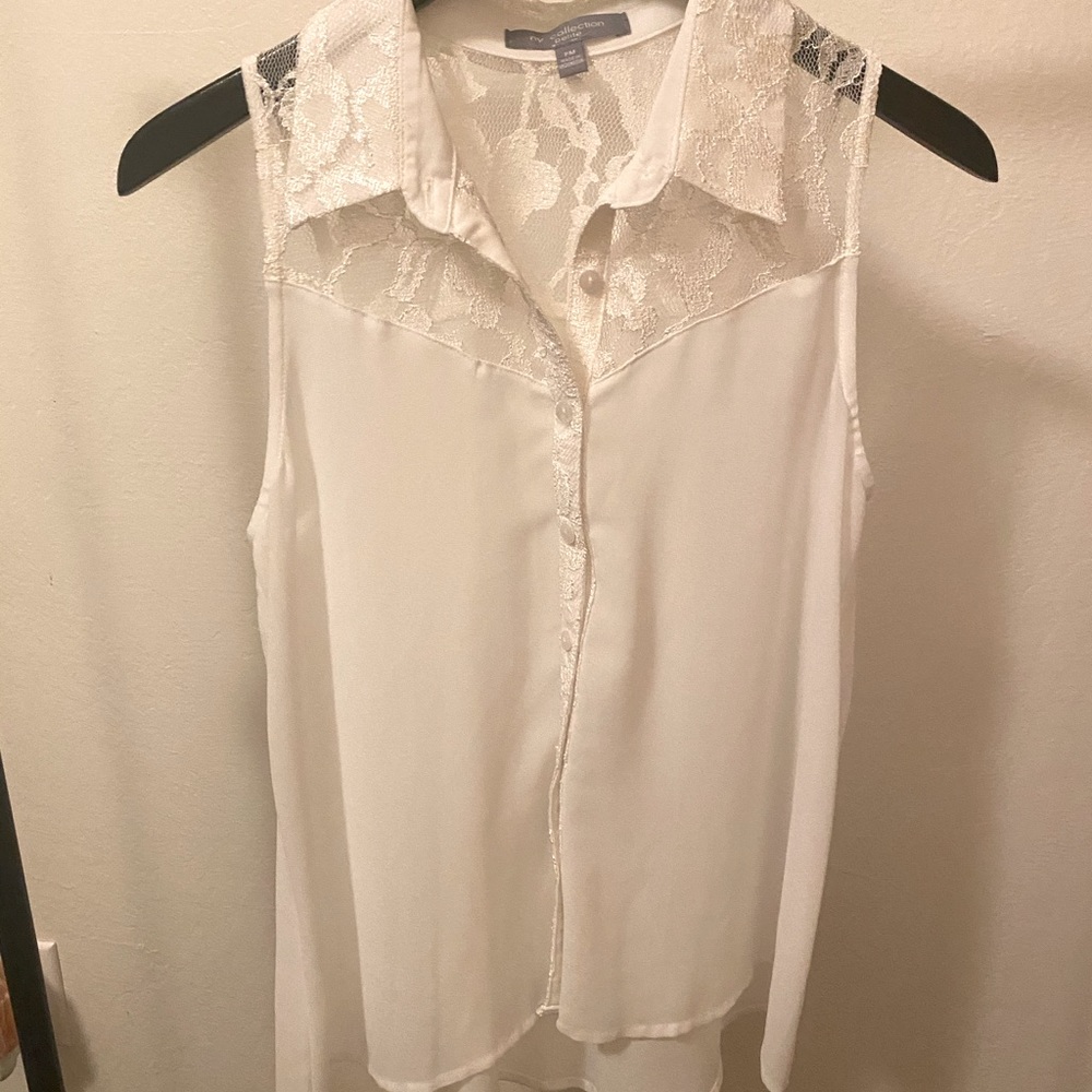 Sleeveless button down dress top.